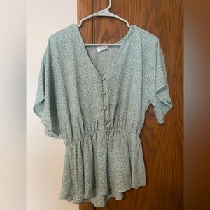 Green and white peplum blouse